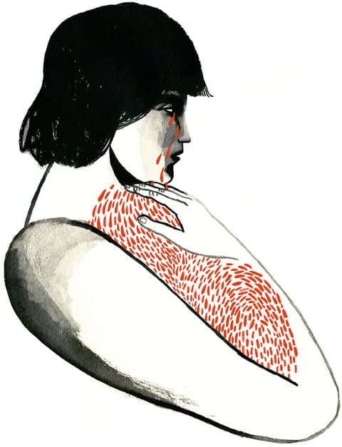 A woman with long hair and red patterned shirt.