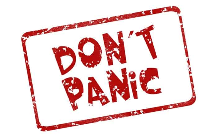 A red stamp that says don 't panic.