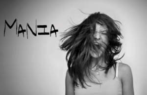 A woman with long hair is standing in front of the words nia.