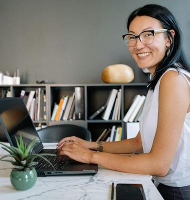 woman using laptop smiling